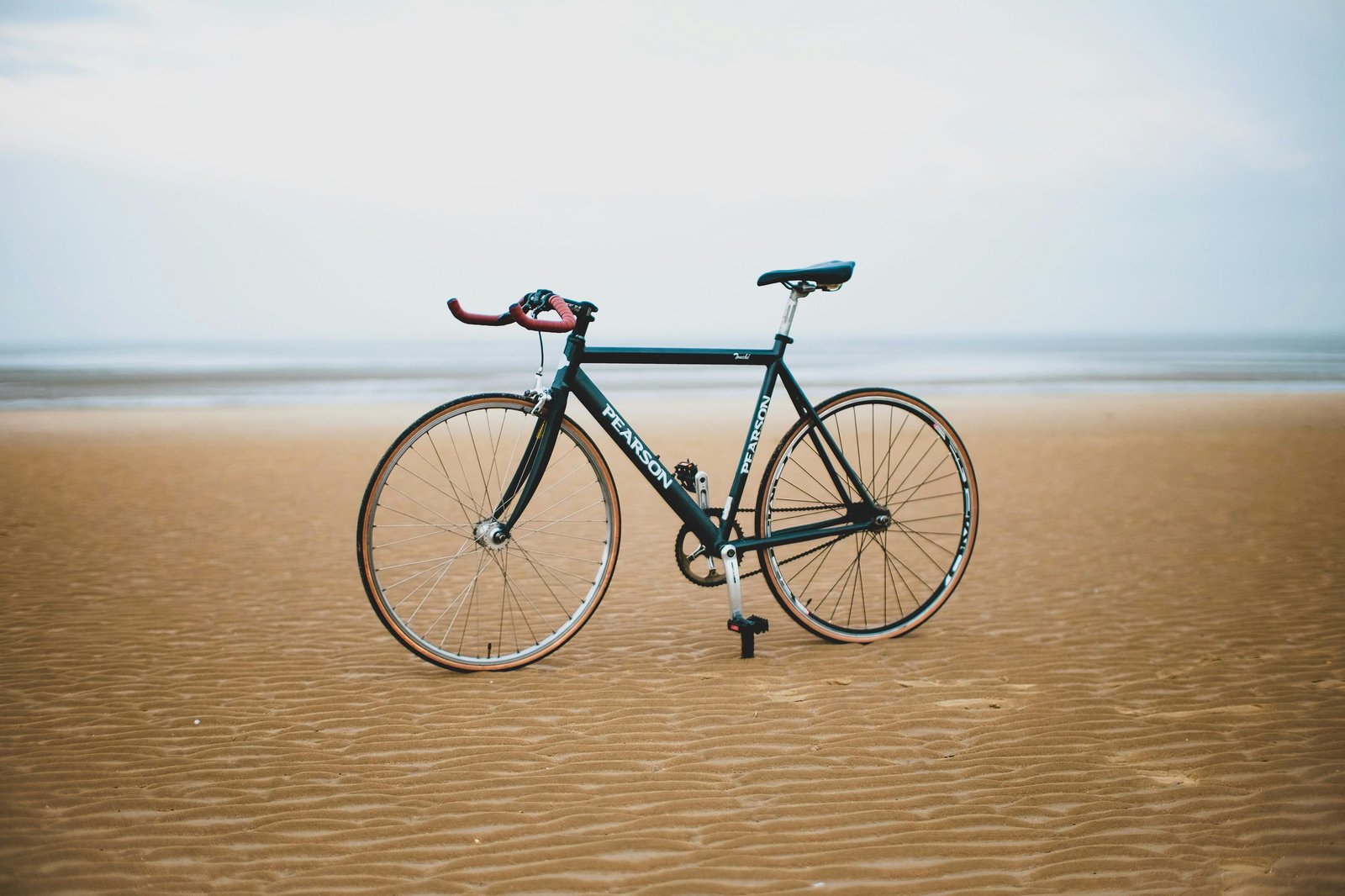 Bicycle parked beside the sea