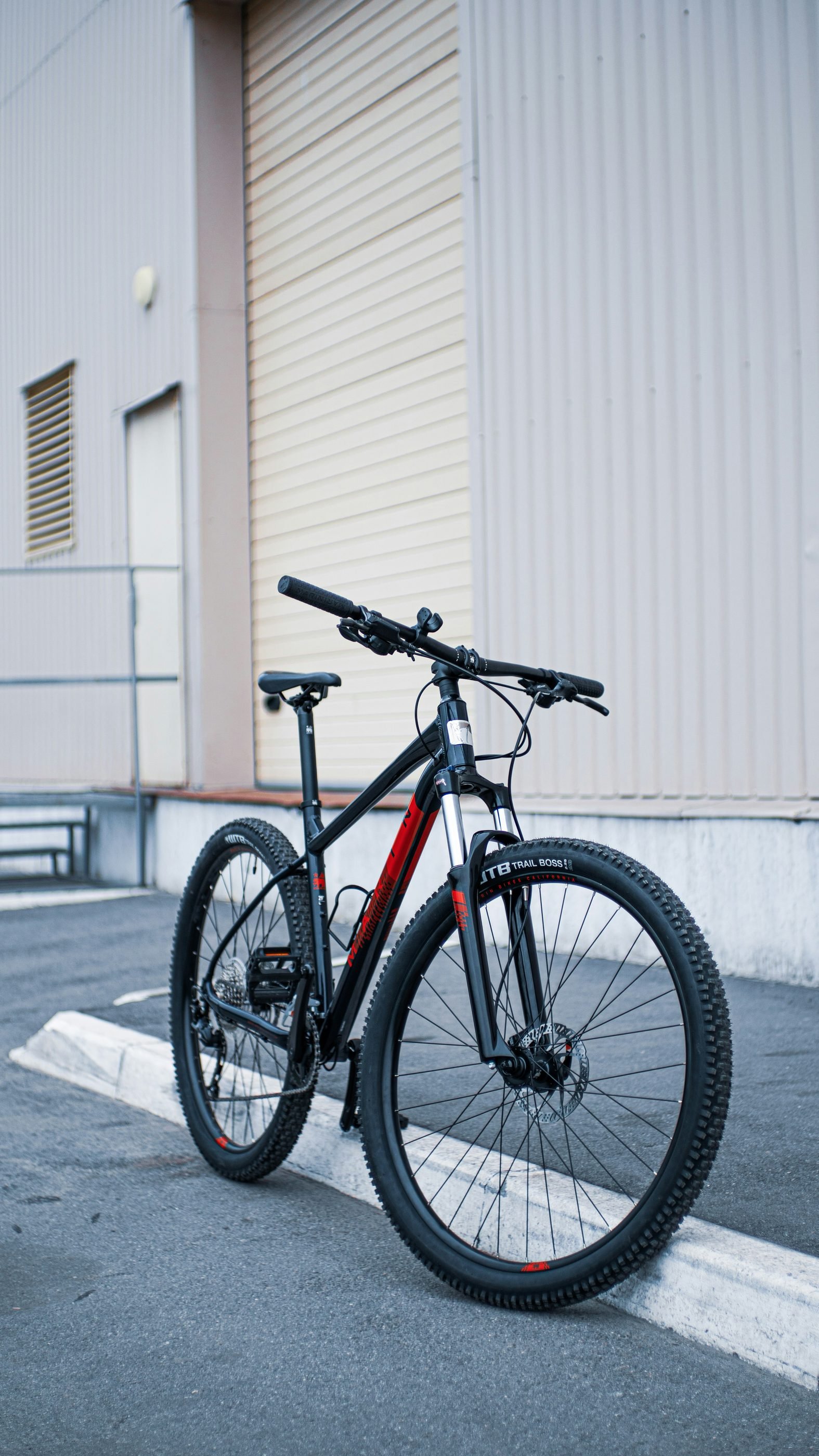 Mountain bike parked against a wall