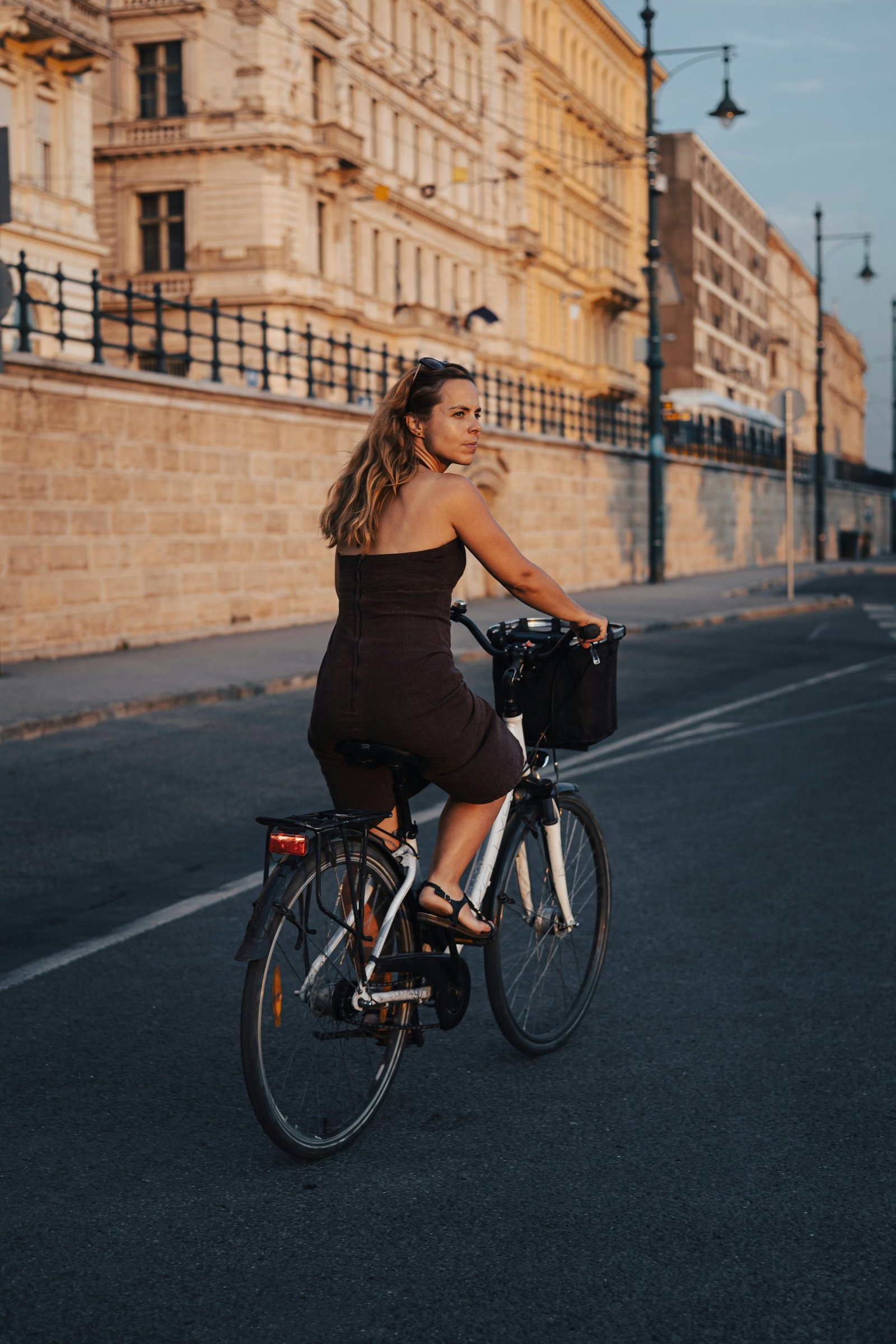 Rider with a front basket cycling through the city