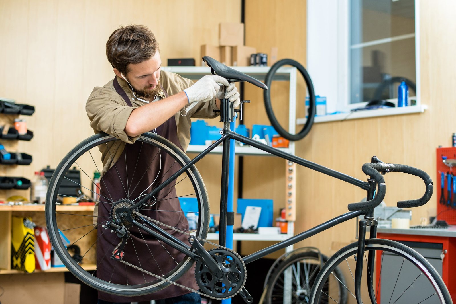 Mechanic adjusting a bike saddle for a proper fit