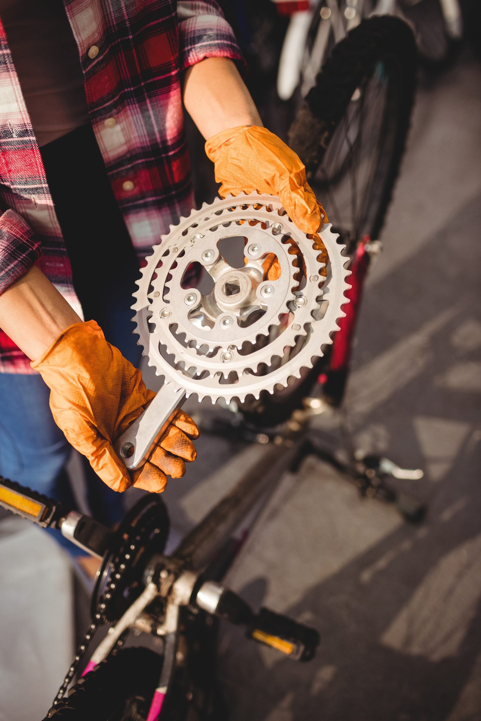 Mechanic holding a bike part